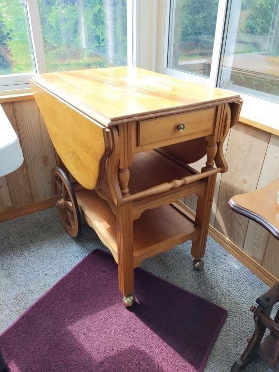 Drop-leaf wooden tea trolley, photographed for an online auction